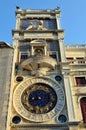 Clock on the wall of the house at St. Mark's Square. Royalty Free Stock Photo