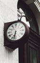 A clock on the wall of an old railway station. The clock is made by a well-known watchmaker, Jean Paul Garnier, in the middle of