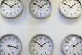 Clocks on wall, symbol for Greenwich Mean Time