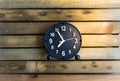 Clock on wood board background.using wallpaper for education, business photo.Take note of the product for book with paper and obje Royalty Free Stock Photo