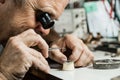 Clockmaker repairing wrist watch