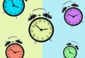 Clocks with different colors isolated on green and blue background