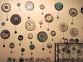 Clocks of different shapes and sizes on the wall of the waWatches of different shapes and sizes on the wall of the watch shop