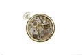 Clockwork details, pinions and wheels macro closeup isolated on white Royalty Free Stock Photo