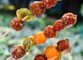 Clode up Tanghulu traditional Chinese snack of candied hard caramel coated fruit skewers Royalty Free Stock Photo