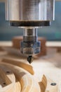 clodeup milling machine carving a piece of wood in the workshop Royalty Free Stock Photo