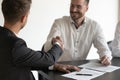 Cloe up of businessmen shake hands closing deal at negotiations Royalty Free Stock Photo