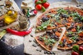 Cloe up of spelt dough pizza with additions top view Royalty Free Stock Photo