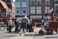 Clog maker selling wooden shoes in Delft.