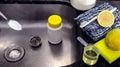 Clogged kitchen sink, dirty pipe being cleaned at home with baking soda, lemon and vinegar Royalty Free Stock Photo