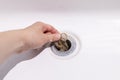 Clogs In Drain, Hair Loss, Hair Fall. Human Hand Pulls Big Tuft Of Blond Hair In White Royalty Free Stock Photo