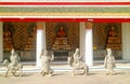 Cloister of Wat Arun Temple with Group of Gilded Buddha Images and Chinese Guardian Sculptures, Bangkok, Royalty Free Stock Photo