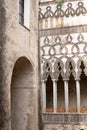 Cloister columns and arch of stone of Villa Rufolo in Ravello, Amalfi Coast, Campania, Italy. Patio. Royalty Free Stock Photo