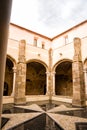 Cloister with cross of the Knights of Malta in the Castle of Crato in Flor da Rosa in Portugal Royalty Free Stock Photo