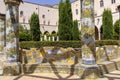 Cloister Santa Chiara with octagonal columns decorated with majolica tiles in rococo style, Naples, Italy