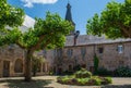 Cloister in the village of Saint-Geniez-d\'Olt in the Aveyron department in France Royalty Free Stock Photo