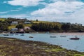 The coast of Ireland. Small fishing boats are anchored in Clonakilty Bay at low tide.