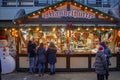 Cloppenburg, Germany - 26.12.2022: Holiday kiosk with gifts and souvenirs. People look at the goods on the counter