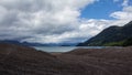 Clos to the lake. Hiking adventure on Osorno Volcano in Los Lagos Region of Chile. .Windy and rainy weather makes Royalty Free Stock Photo