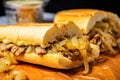 close capture of philly cheesesteak with caramelized onions peeking out