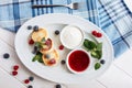 Close cheese pancakes, syrniki, curd fritters with fresh raspberries on white plate background. Top horizontal view.