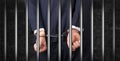 Close handcuffed man in jail