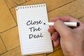 Close the deal concept on notebook Royalty Free Stock Photo