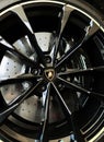 Detail of black Lamborghini exotic car wheel with logotype