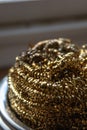 Close detailed image of a small decorative gold tinsle Royalty Free Stock Photo