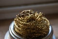 Close detailed image of a small curled gold tinsle Royalty Free Stock Photo