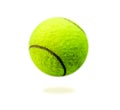 The close distance of the yellow tennis ball is pretty clear. Single ball isolated on a white background that can be easily used t