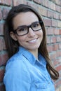 Close face of brunette female with glasses