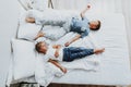 Brother and sister sleeping on bed after playing Royalty Free Stock Photo