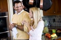 Close father and teen daughter chatting in kitchen