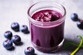 close focus on blueberry puree in a glass container