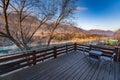 Close focus soft focus, mountain landscape, view from the balcony, the Katun river, rocky shores, mountain taiga with blue sky and Royalty Free Stock Photo