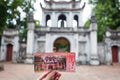 Close focus on ticket in front of gate of temple of literature i