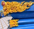 Close of golden ornamentation of Wat Rong Suea Ten Blue Temple at Chiang Rai Thailand