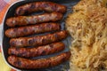 Close grilled Nuremberg sausages with sauerkraut Royalty Free Stock Photo