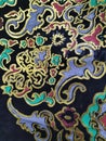 close image of wall ornament with colorful abstract pattern, known as batik pattern