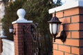 Close Iron Street Lantern On Brick Column Gate. Royalty Free Stock Photo