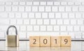 Close key lock with year number 2019, keyboard background Royalty Free Stock Photo