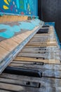 A close of the keys on an old, weathered piano with selective focus on some