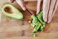 Close knife with avocado cubes on the board of the house step 6