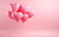 Close knit bunch of pastel pink heart shaped balloons tied together on pink background Royalty Free Stock Photo