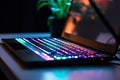 Close laptop keyboard colorful neon illumination, backlit keyboard Royalty Free Stock Photo