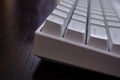 Close view of a white mechanical keyboard with ESC key in the front Royalty Free Stock Photo