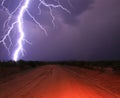 Close Lightning Strike in the Desert on a Dirt Road