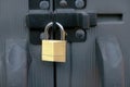 A close lock at a storage shed door entrance.