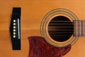 Close macro view of the six frets  on an acoustic guitar Royalty Free Stock Photo